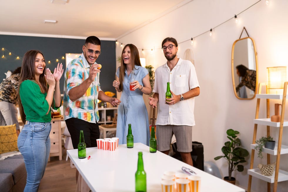 friends playing beer pong