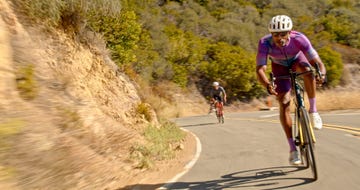 black male cyclist leading peloton on a bike ride