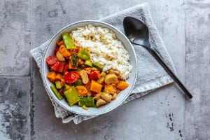 bowl of vegan sweet potatoe curry with rice, best types of carbs