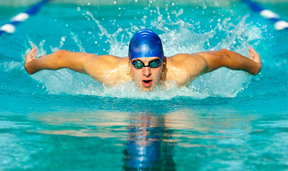 Caucasian swimmer in swimming lane