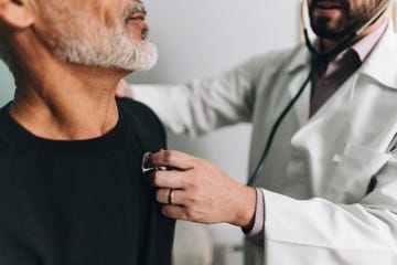 close up of a doctor examining a patient on a hospital