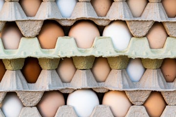 color photograph of farm fresh eggs in stacked crates