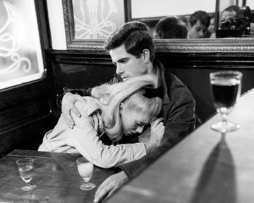 french actress catherine deneuve, as genevieve emery, and italian actor nino castelnuovo as guy foucher, in a production still from the umbrellas of cherbourg les parapluies de cherbourg, directed by jacques demy, 1964 a camera operator is visible in the mirror top, right photo by silver screen collectiongetty images