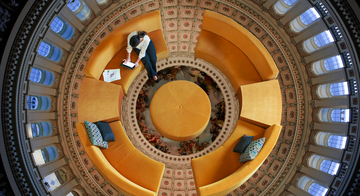 a person standing on a spiral staircase