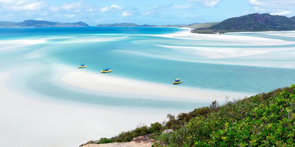 a beach with boats in it