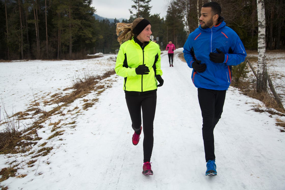 couple running on road