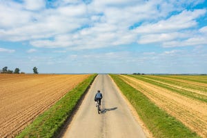 cyclist on road in countryside