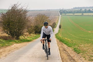 hill workouts cyclist on road in countryside