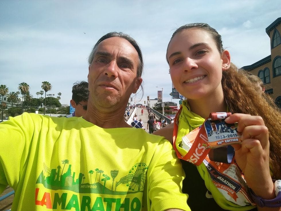 david simon with medal and young woman