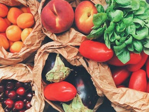 Directly Above Shot Of Fruits And Vegetables In Paper Bags