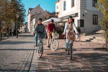 diverse group of friends enjoying a bike ride in urban setting