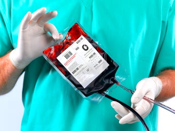 doctor holding blood bag
