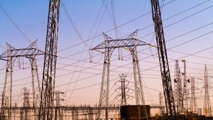 high voltage electricity towers at a substation in central california