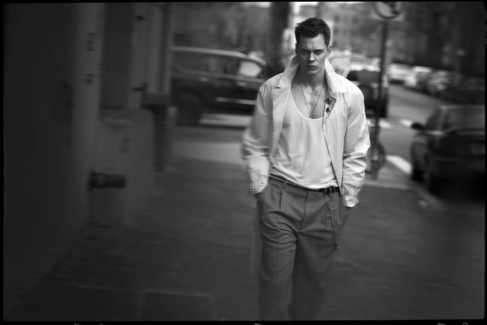 a man walking down a sidewalk