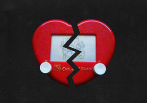 a broken heart shaped etch a sketch toy