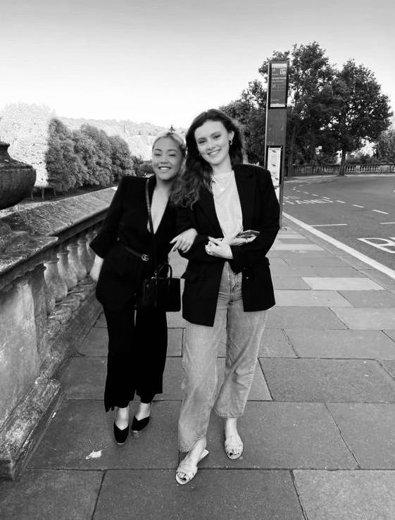 charlotte and roberta smile for a photograph together in a garden