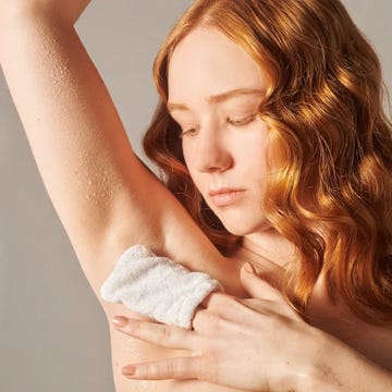 woman with an exfoliating glove