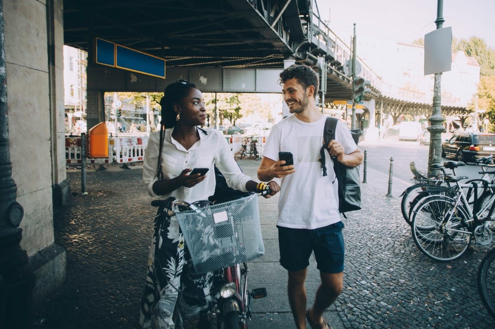 a man and a woman on a bicycle