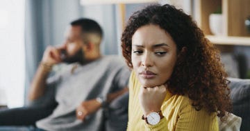 shot of a young couple having a disagreement at home