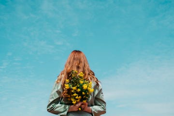 a person holding a bouquet of flowers