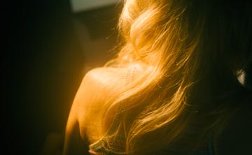 caucasian woman with blonde hair, close up hair curls with copy space