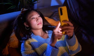 asian girl using mobile phone, texting and surfing on social media