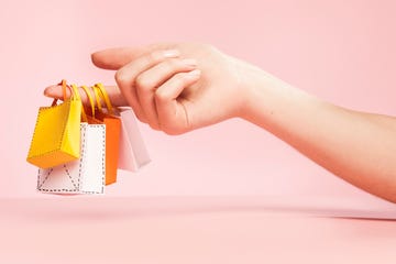 hand, finger, fingers, tiny, tiny shopping bags, shopping, bags, bag, yellow, white, orange, pink