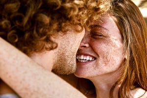 a man and woman kissing