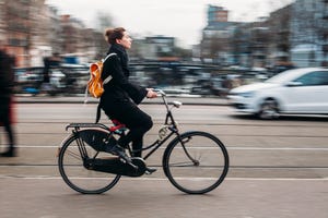 amsterdam, netherlands people rides bicycle in street of amsterdam