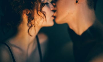 heterosexual couple kissing