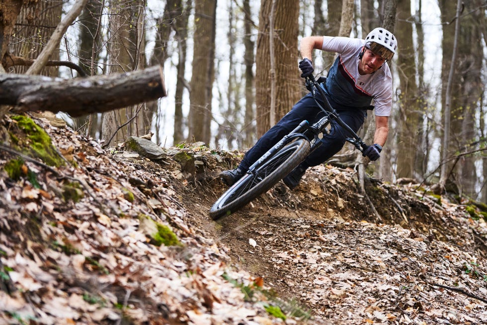 man descending on mountain bike burm