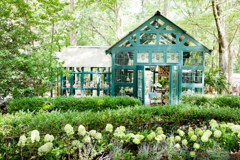 green garden retreat made of salvaged windows