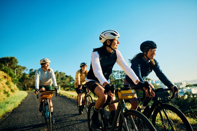 group of female cyclists, bonding on a weekend ride out of the city