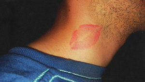 man's neck with lipstick kiss mark on it