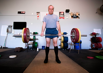 mike harrington at the top of a barbell deadlift