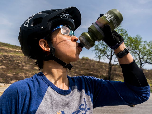 rosael torres drinking from her water bottle after a mtn bike ride in 2023