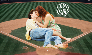 a couple making out on a baseball diamond