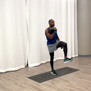 beginner kettlebell workout, jeffers practicing the front racked march exercise