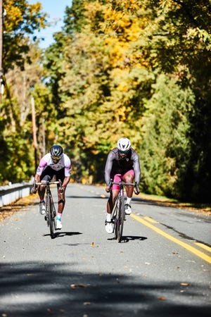 two people riding bikes