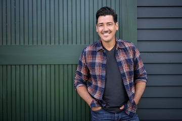 jonathan knight in front of the restored barn at his new england farmhouse, as seen on farmhouse fixer