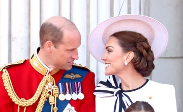 prince william and kate middleton look at one another and smile during the trooping the colour ceremony