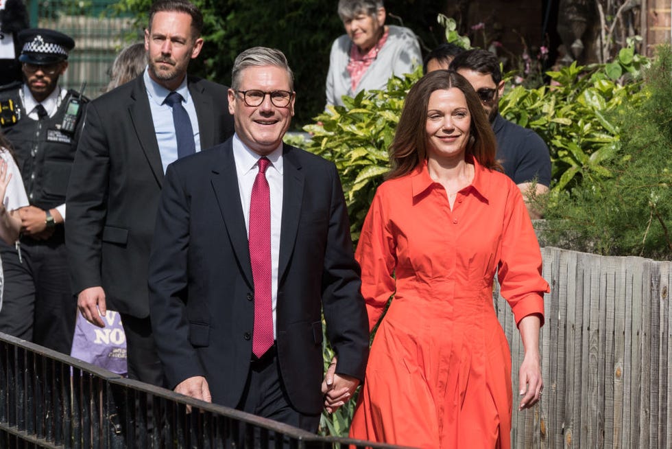 leader of the labour party sir keir starmer and his wife victoria walk to a polling station to cast their votes in the general election