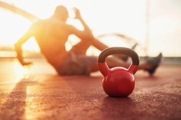kettle bell in focus, fitness training at early morning