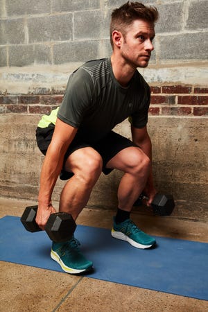 cyclist doing weighted squats