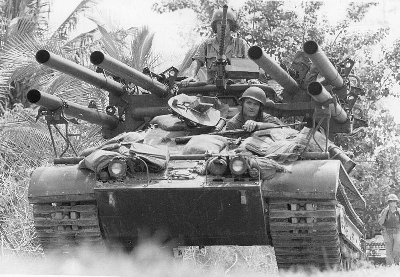 a group of men in a tank