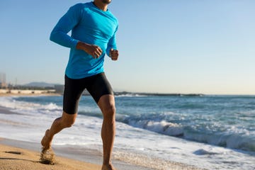 man jogging on the beach