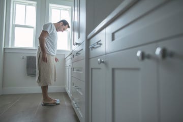 man on bathroom scale