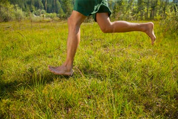 man running in the nature only lower extremities