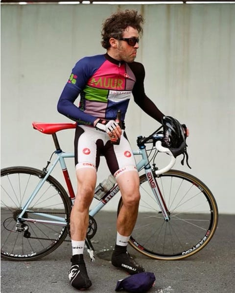 mark taylor sitting on bike with beer