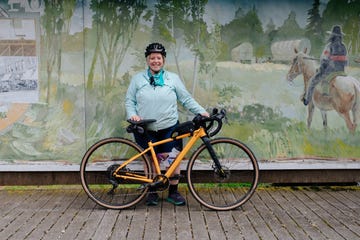 marley blonsky standing with bicycle